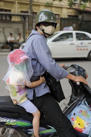 Vietnam, Hanoi, motorcycle traffic in the old city, protection against the polllution