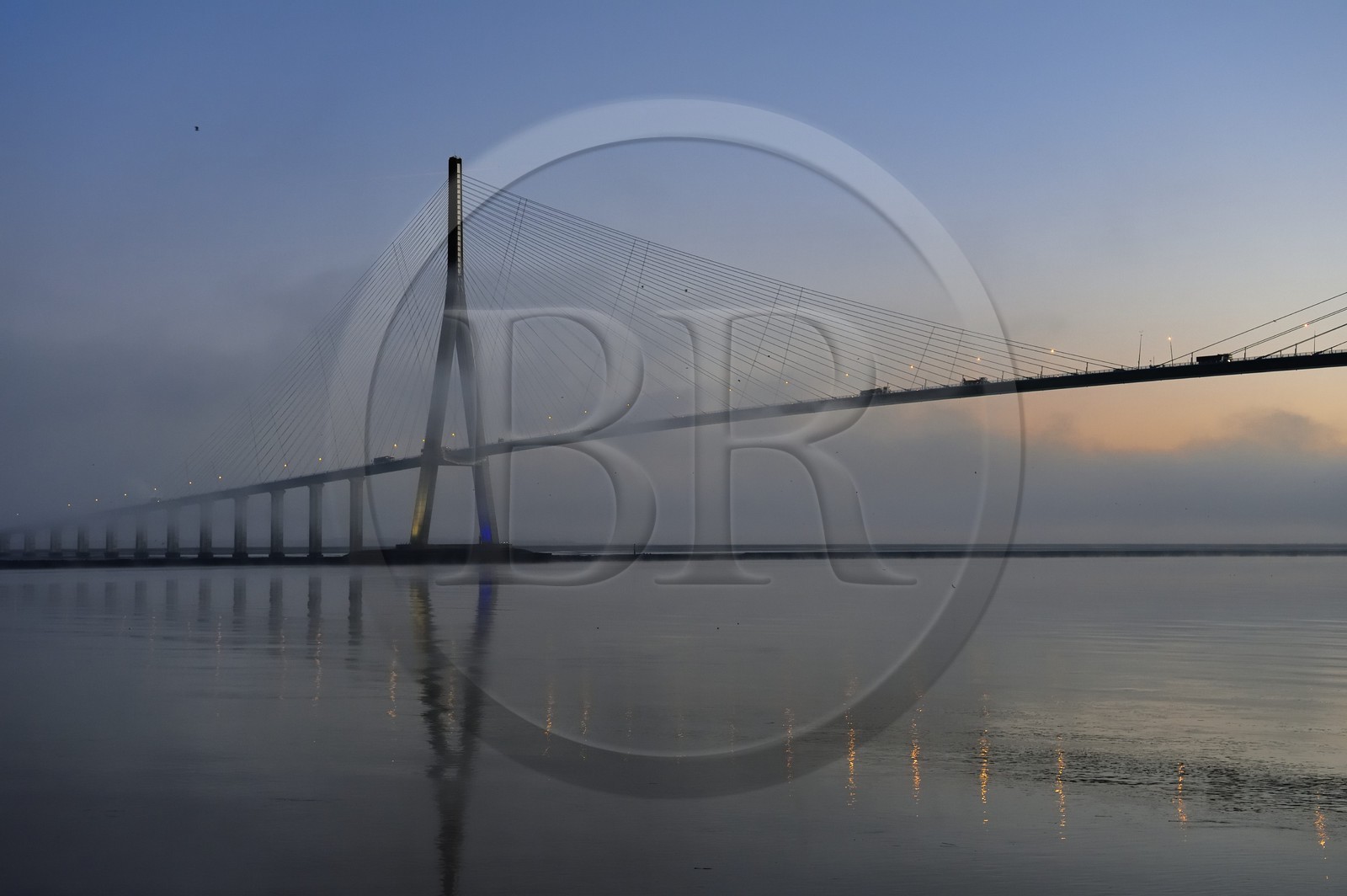 France, between  Calvados and Seine Maritime, the Pont de Normandie (Normandy Bridge) in the mists of dawn, it spans the Seine to connect the towns of Honfleur and Le Havre
