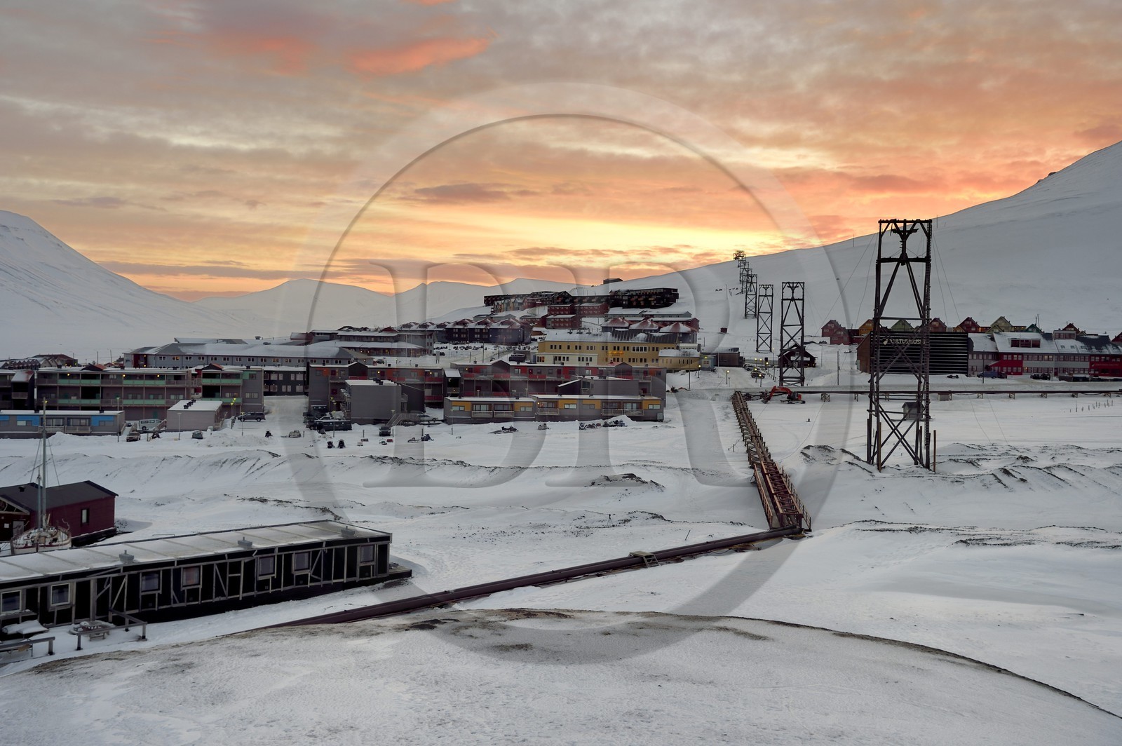 Norway, Svalbard, Spitzbergen, Longyearbyen, thermal heating pipes that cross Longyearbyen above ground because of permafrost and former coal carrying headframes
