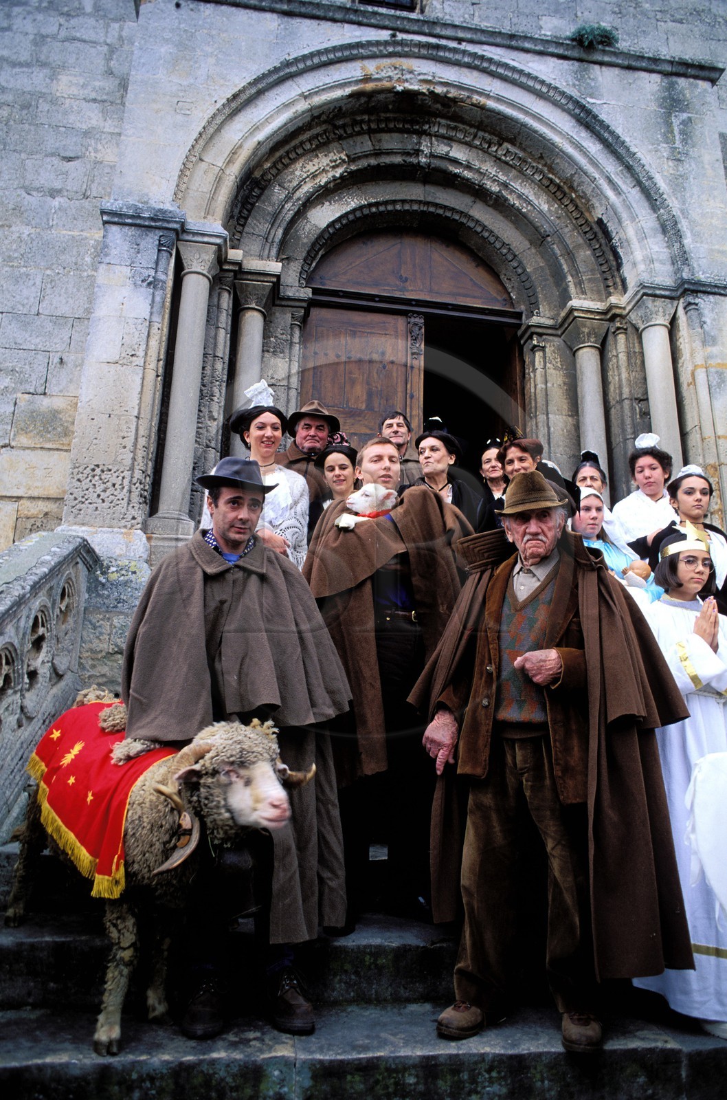 France, Bouches du Rhone, Les Baux de Provence village, labelled Les Plus Beaux Villages de France (The Most Beautiful Villages of France), Christmas celebrations, going out of church at the midnight mass