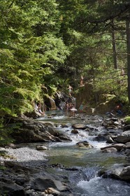 France, Hautes Pyrenees, Saint Lary Soulan, Rioumajou valley, swimming in the river Neste de Rioumajou