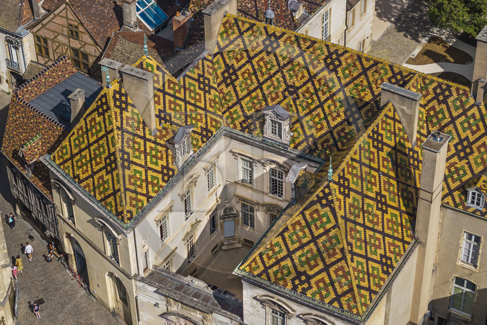France, Cote d'Or, Dijon, area listed as World Heritage by UNESCO, colorful glazed tile roof of the Hotel de Vogüé (aerial view)
