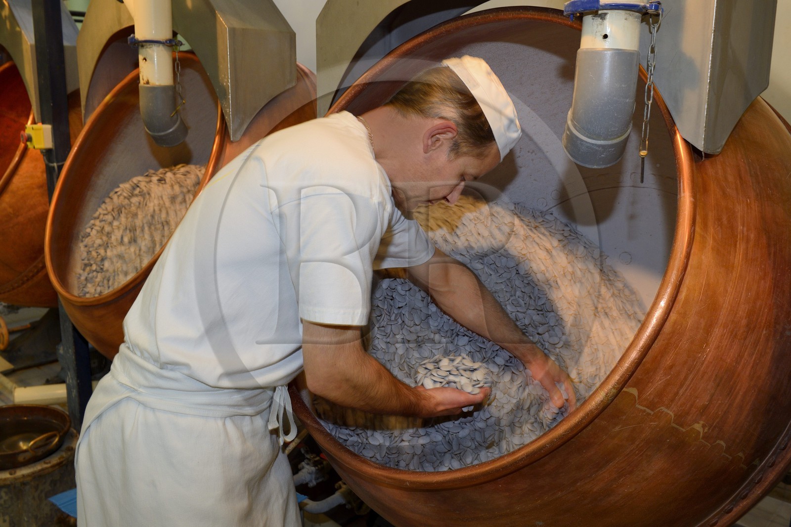 France, Meuse, Verdun, Braquier sugared almonds (dragee) factory, peeling almonds, operation designed to cover the almonds with a film and prevent oil from migrating to the outside