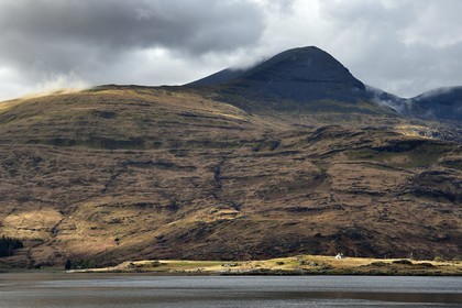 United Kingdom, Scotland, Highland, Inner Hebrides, Isle of Mull, traditional house on the edge of Loch Scridain