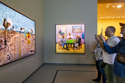 France, Paris, Bois de Boulogne, the Louis Vuitton Foundation by architect Frank Gehry, David Hockney exhibition 25, A Bigger Card Players (2015) and Pearblossom Hwy., 11-18th April 1986 No. 2 in the foreground