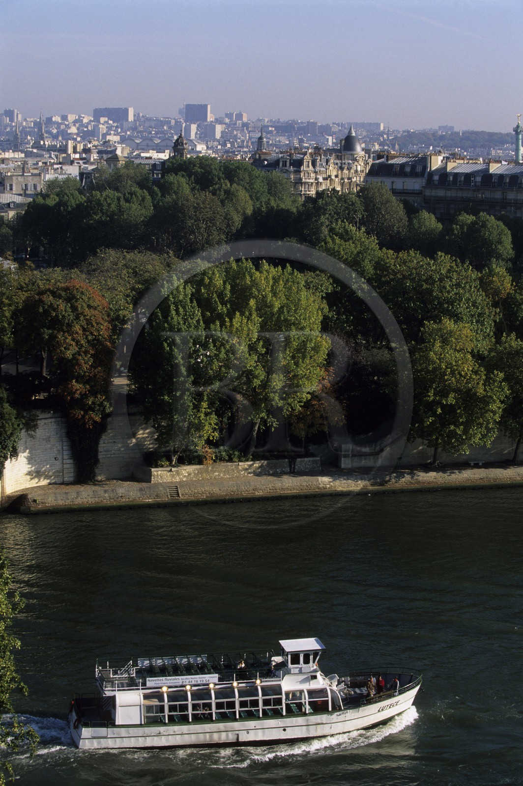 France, Paris, banks of the Seine river listed as World Heritage by UNESCO, boat next to the headland of the Ile de la Cite