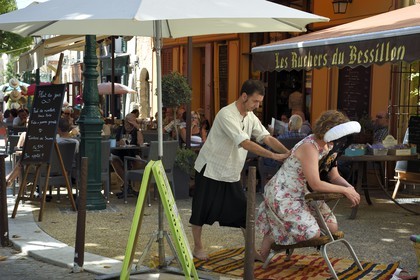 France, Var, Provence Verte, Cotignac, market day on the main square, massage in the street