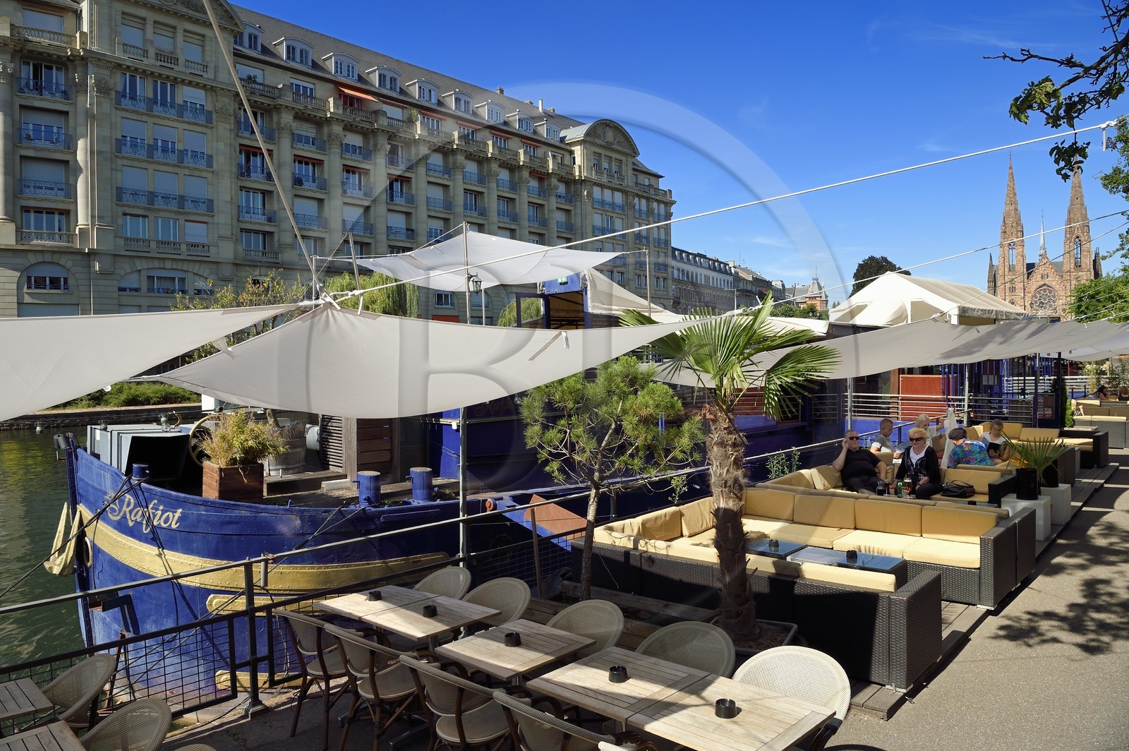 France, Bas Rhin, Strasbourg, Neustadt district dating from the German period listed as World Heritage by UNESCO, Café barges along the Quai des Pecheurs on the banks of the River Ill and the Saint-Paul Protestant Church in the background
