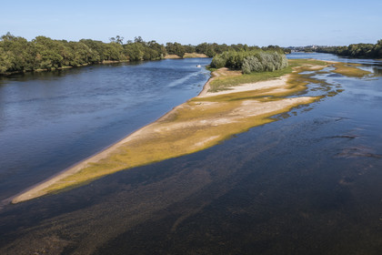 France, Maine-et-Loire, Loire valley listed as World Heritage by UNESCO, sandbanks forming islands on the Loire and Saumur castle in the background (aerial view)