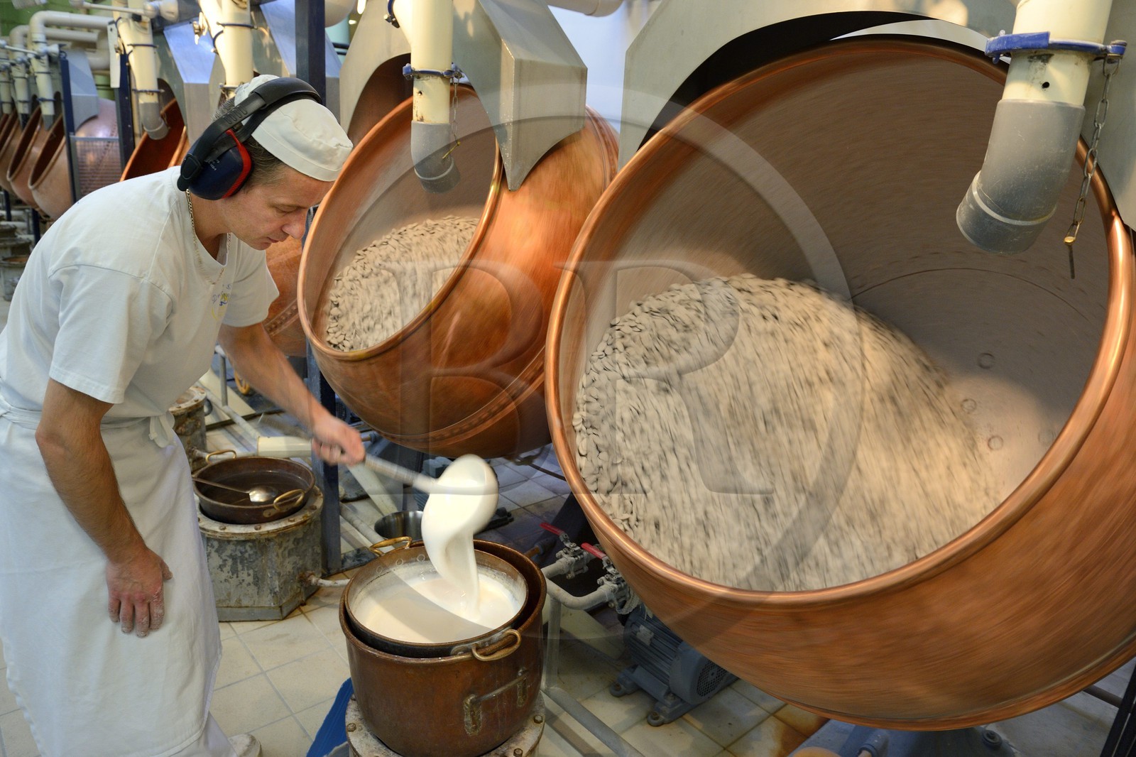 France, Meuse, Verdun, Braquier sugared almonds (dragee) factory, peeling almonds, operation designed to cover the almonds with a film and prevent oil from migrating to the outside