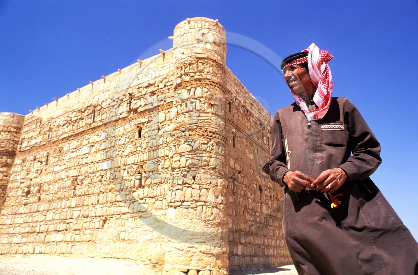 Jordan, guardian of 8th century Qasr Kharaneh or Castle of the Desert