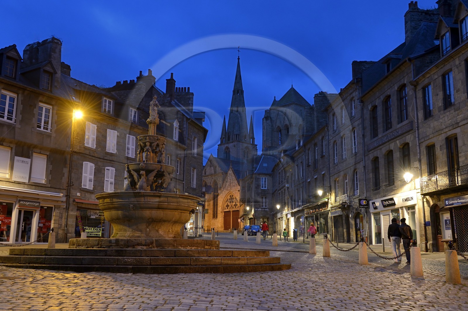 France, Cotes-d'Armor, Guingamp, the Plomee Fountain in the place du Centre and the Notre Dame street leading to the Basilica of Notre Dame de Bon secours