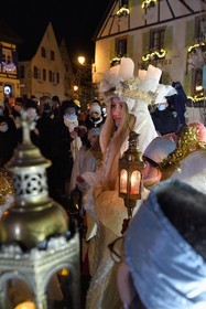 France, Haut Rhin, Eguisheim, the Christkindel with its crown of candles and the angels accompany the many children holding their lanterns for the Procession of Lights in the alleys of the town, it pays homage to Saint Lucia, one of the traditional characters of Alsatian Christmas