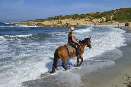 France, Haute Corse, Nebbio, Agriates Desert, Peraiola Cove, rider on the Ostriconi beach