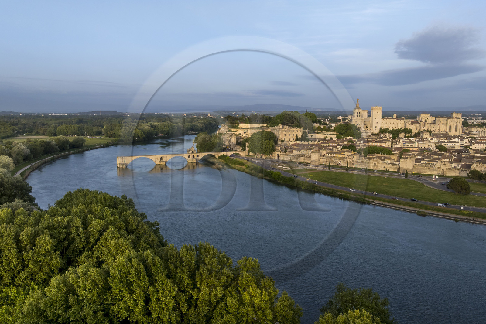 France, Vaucluse, Avignon, the Saint-Bénézet bridge (Pont d'Avignon) on the Rhone river and the Palais des Papes (Palace of the Popes), listed as World heritage by UNESCO, in the background (aerial view)