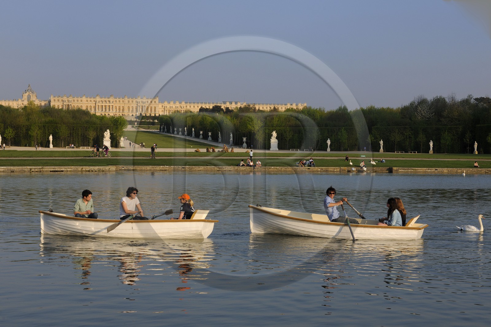 France, Yvelines, park of the Chateau de Versailles, listed as World Heritage by UNESCO, small boats on the Grand Canal then the Apollo Basin by Tuby with the Apollo's Cart and Axe du Soleil (the Sun Axis) to the castle