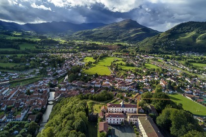 France, Pyrenees Atlantiques, Basque Country, Saint Jean Pied de Port overlooked by the citadel and crossed by the Nive of Beherobie river (aerial view)