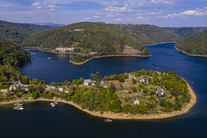 France, Aveyron, peninsula of Laussac, reservoir of the Sarrans dam, the Monts du Cantal in the background on the left (aerial view)