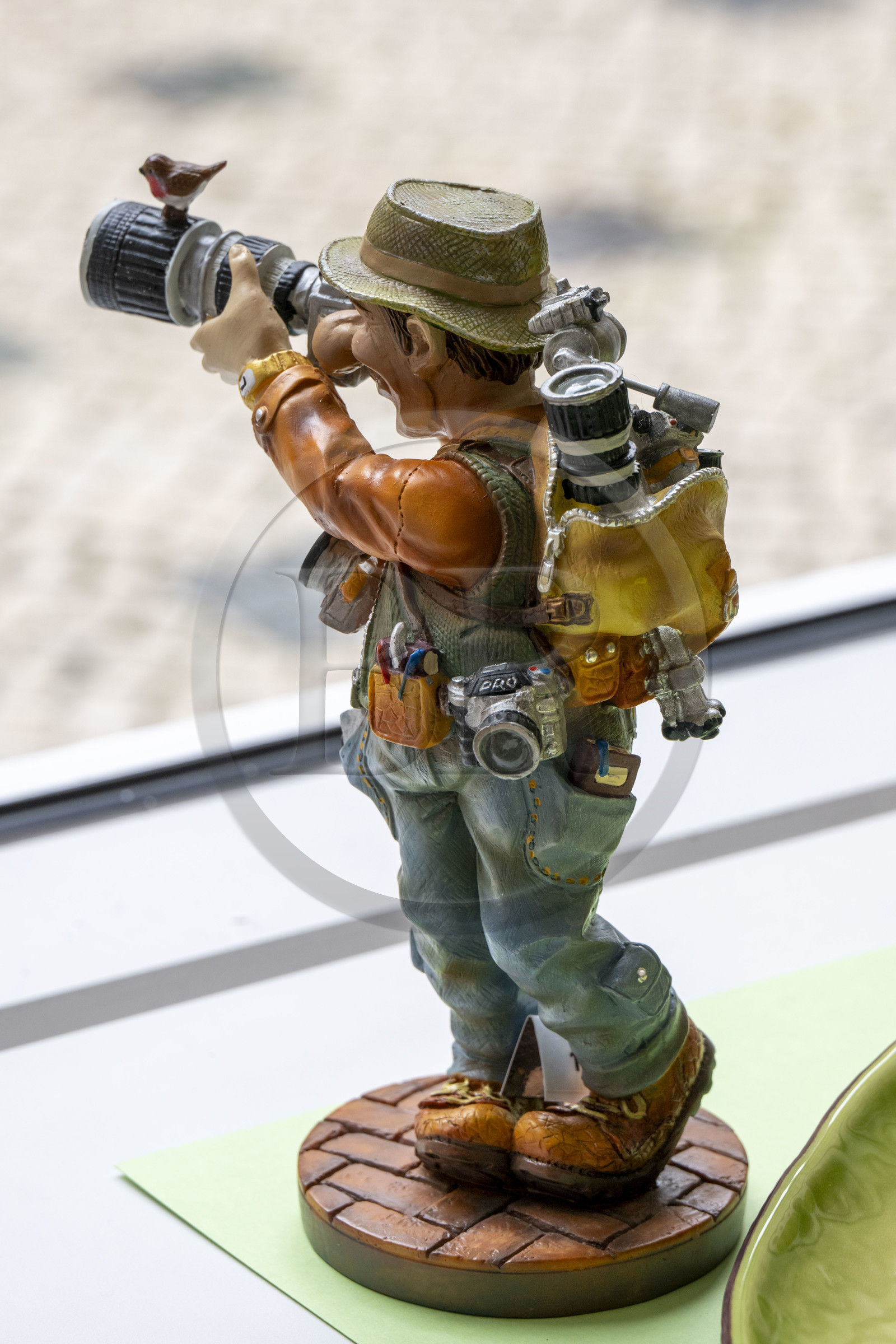 Portugal, Lisbon, statuette representing an over-equipped globetrotting photographer
