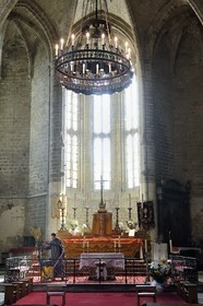France, Haute Loire, Livradois Forez Regional Natural Park (Parc naturel régional Livradois-Forez), the Chaise-Dieu abbey, Saint Robert abbey church, a brother vacuuming around the altar
