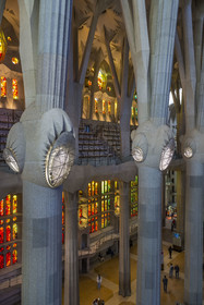 Spain, Catalonia, Barcelona, Eixample district, Sagrada Familia basilica by Catalan modernist architect Antoni Gaudi, listed as a UNESCO World Heritage Site, stained-glass windows in the naves representing the saints and shrines of local churches by the Catalan painter and stained glass artist Joan Vila-Grau and the bins designed to accommodate large choirs