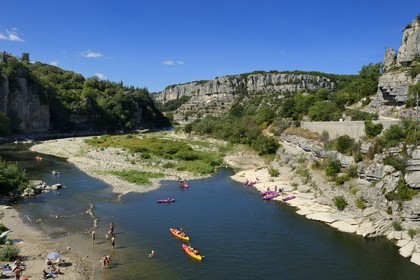 France, Ardeche, Balazuc, labelled Les Plus Beaux Villages de France (The Most Beautiful Villages of France), kayaks going down the Ardeche River