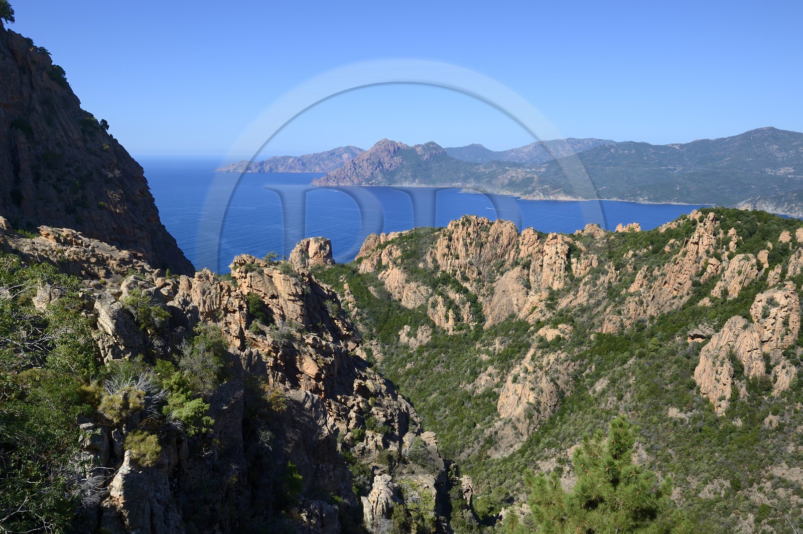 France, Corse du Sud, Golfe de Porto, listed as World Heritage by UNESCO, the Creeks of Piana (Calanches de Piana) with pink granite rocks, the Capo Senino and the Scandola peninsula Nature Reserve in the background