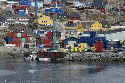 Greenland, west coast, Baffin bay, the town of Uummannaq clinging to the rock, the port