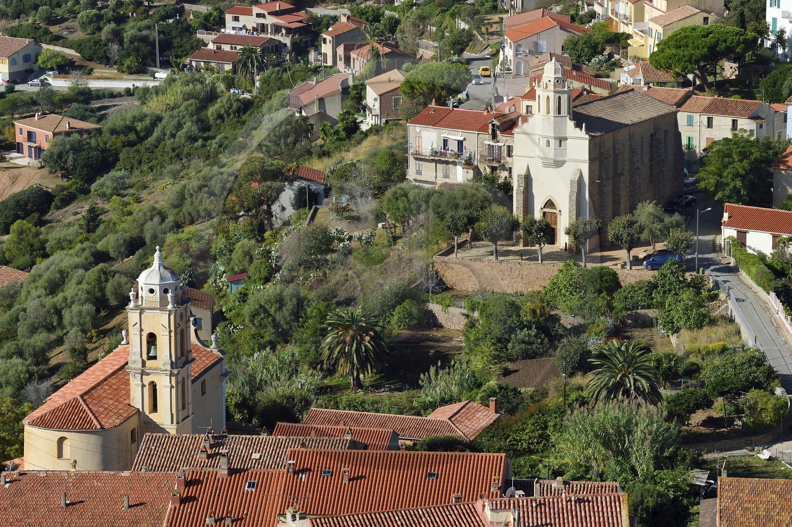 France, Corse du Sud, Cargese, the catholic church (latin rite)  in the foreground and the Greek catholic church of Saint Spyridon (Eastern rite or Uniate) in the background