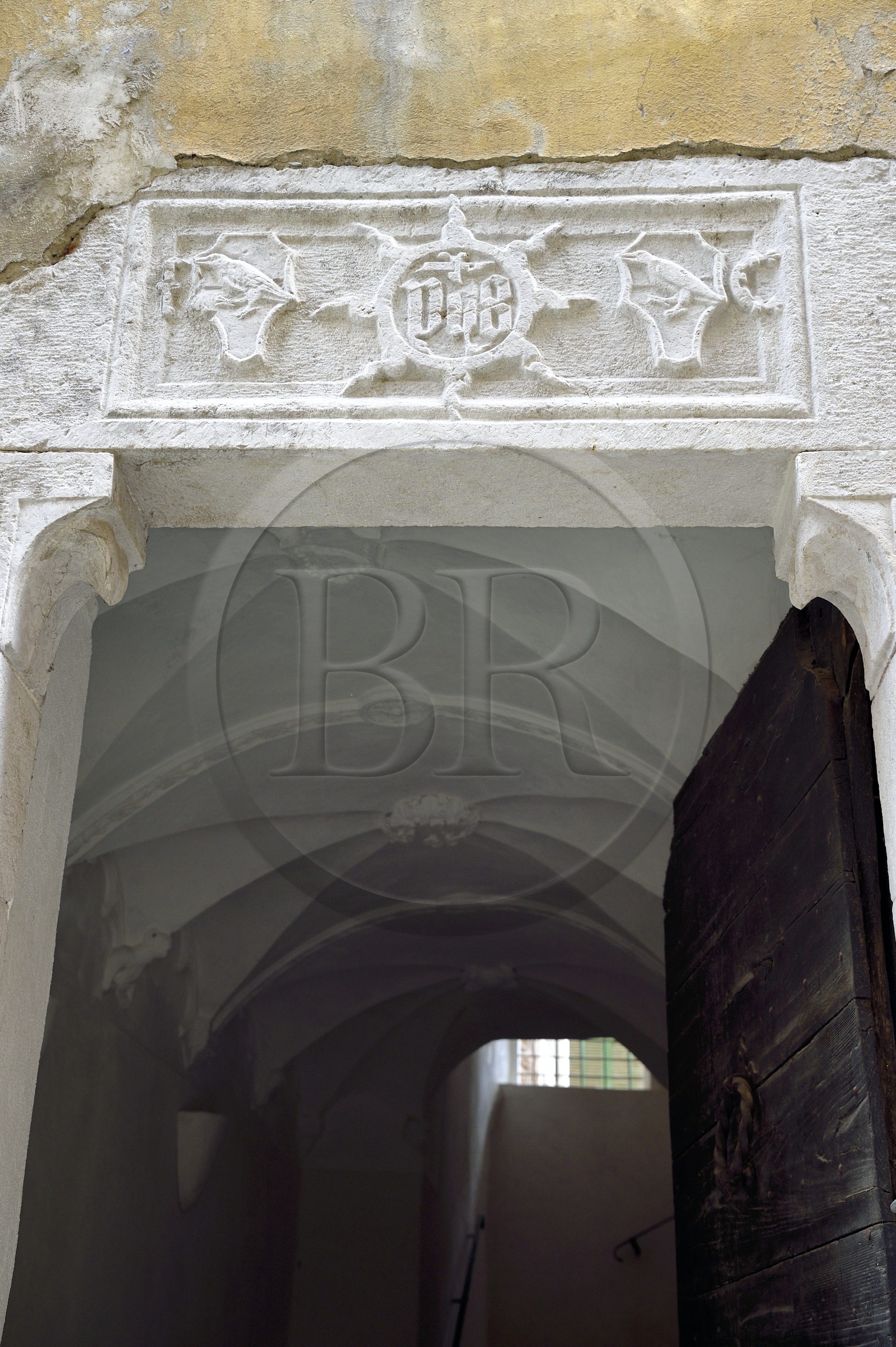 France, Alpes-Maritimes, Bevera Valley, Sospel, lintel engraved with the monogram IHS meaning Jesus savior of men that keeps evil spirits away from the house, building of the Corvesi family (which explains the carved raven)