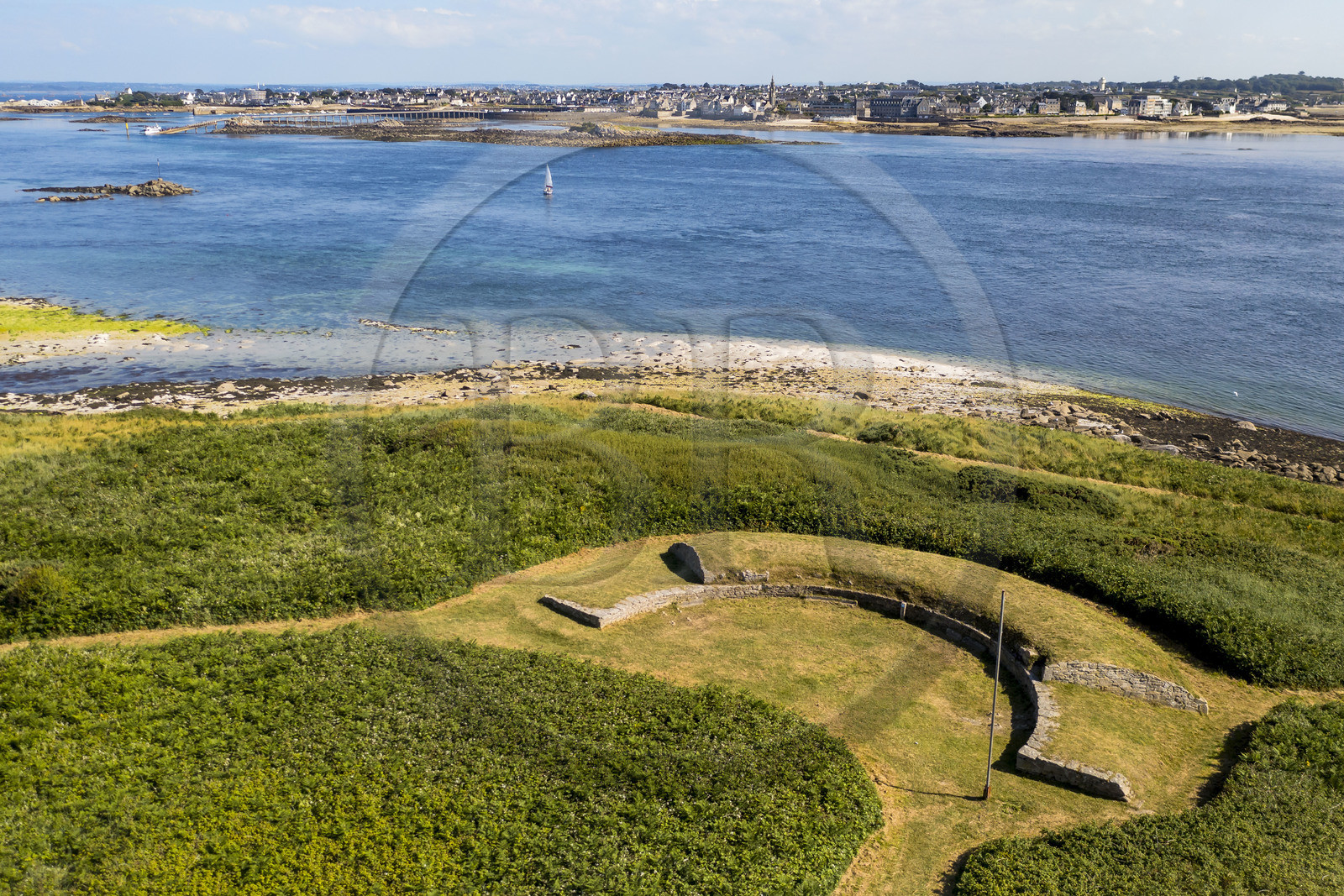 France, Finistère, Ponant Islands, Ile de Batz (Batz Island), the C'hleguer battery built around 1710 to control the channel and Roscoff with the large slipway in the background (aerial view)