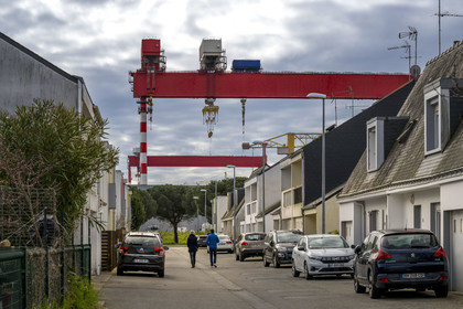 France, Loire-Atlantique, Saint-Nazaire, street in the Méan-Penhoët district overlooking the porticos of the Chantiers de l'Atlantique