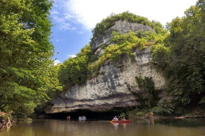 France, Dordogne, Perigord Noir, Vezere Valley at Peyzac le Moustier, canoeing on the Vezere river under the Roque Saint-Christophe cliffs
