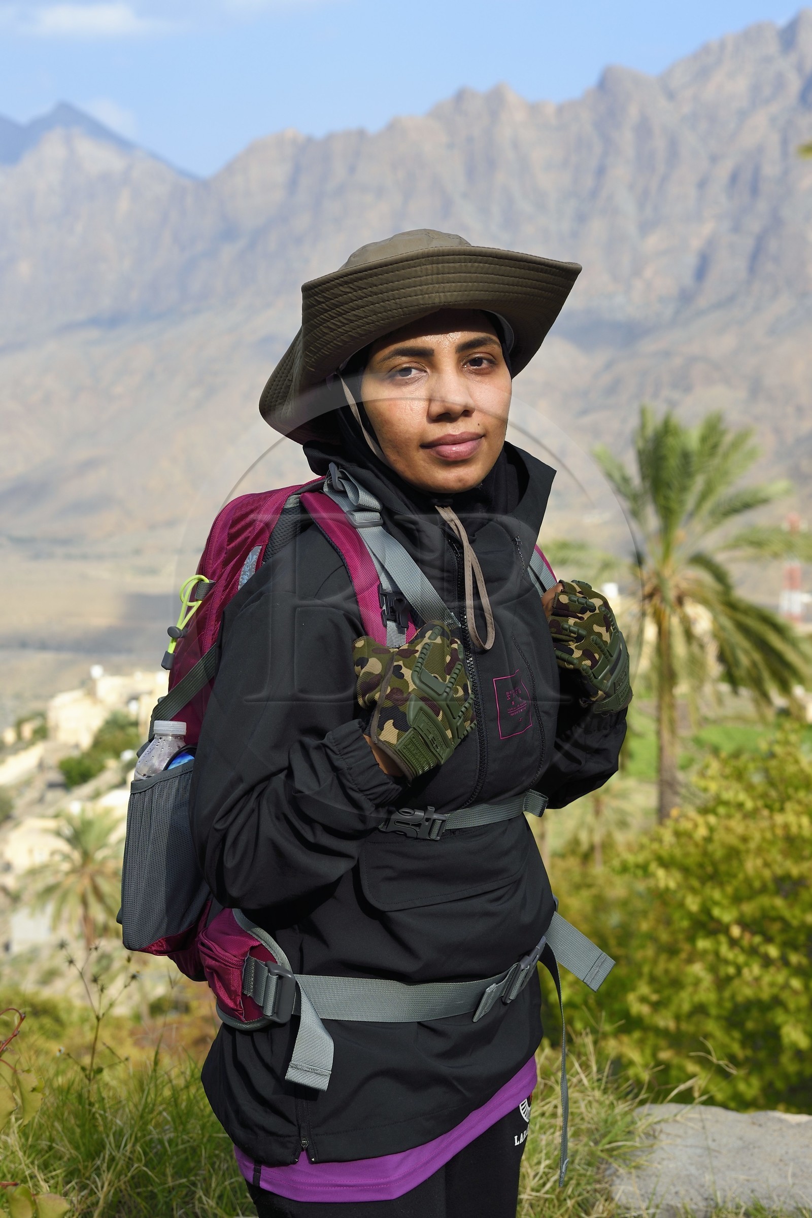 Sultanate of Oman, South Batinah Governorate, Western Hajar, Wadi Mistall, the hiker Badour Al Salhi in the terraced crops overlooking the village of Wakan (Wukan)