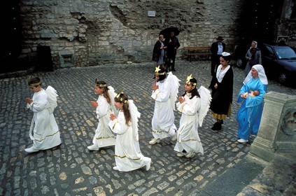 France, Bouches du Rhone, Les Baux de Provence village, labelled Les Plus Beaux Villages de France (The Most Beautiful Villages of France), Christmas celebrations, young angels going to the midnight mass