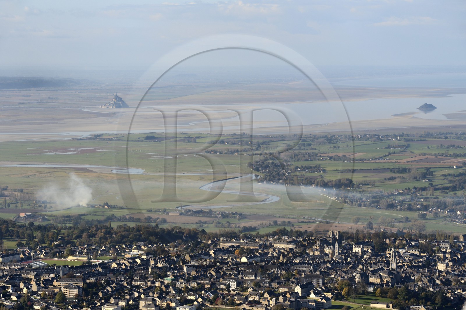 France, Manche, Bay of Mont Saint Michel, listed as World Heritage by UNESCO, Mont Saint Michel at low tide and the city of Avranches in the foreground (aerial view)