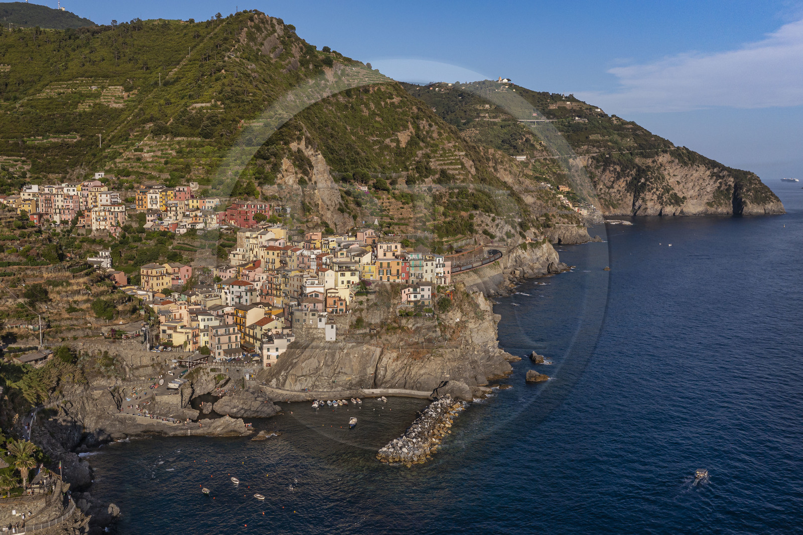 Italy, Liguria, Cinque Terre National Park listed as World Heritage by UNESCO, village of Manarola and its harbour (aerial view)