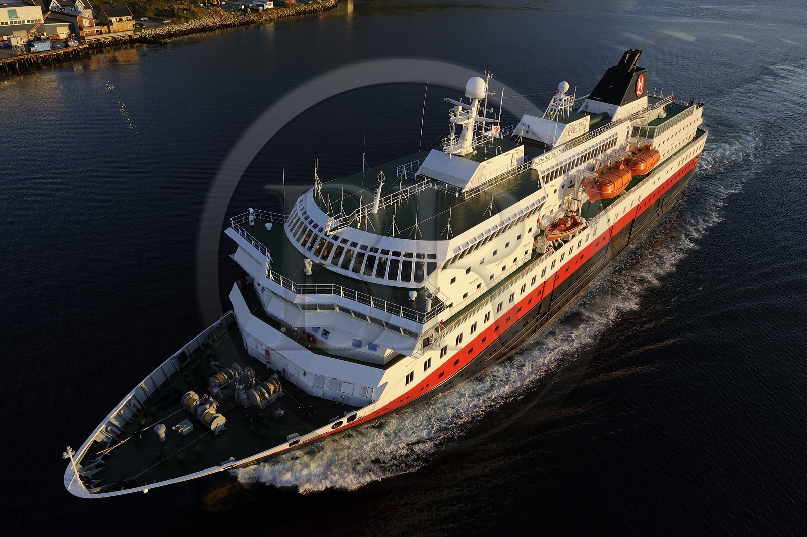 Norway, Troms County, Tromso harbour, the Coastal Express (Hurtigruten) in Tromsesundet Fjord