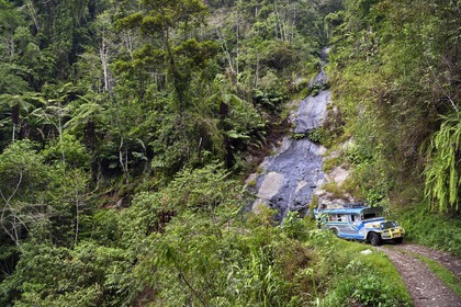 Philippines, Ifugao province, Banaue region, jeepney (elongated jeep to transport passengers) progressing on a mountain track to Cambulo
