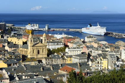 France, Haute Corse, Bastia, St Jean Baptiste Church and the commercial harbor in the background