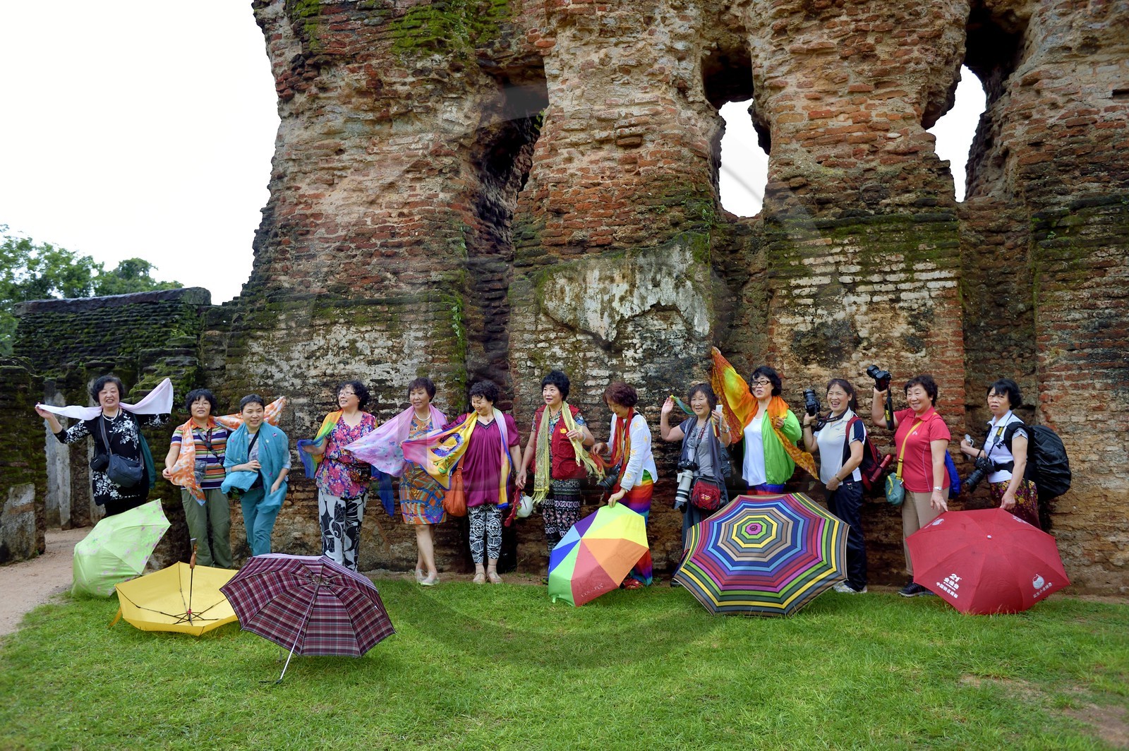 Sri Lanka,  North Central province, Polonnaruwa, the former capital of the country (11th to 13th century) listed as World Heritage by UNESCO, Chinese tourists in front of the Royal Palace ruins