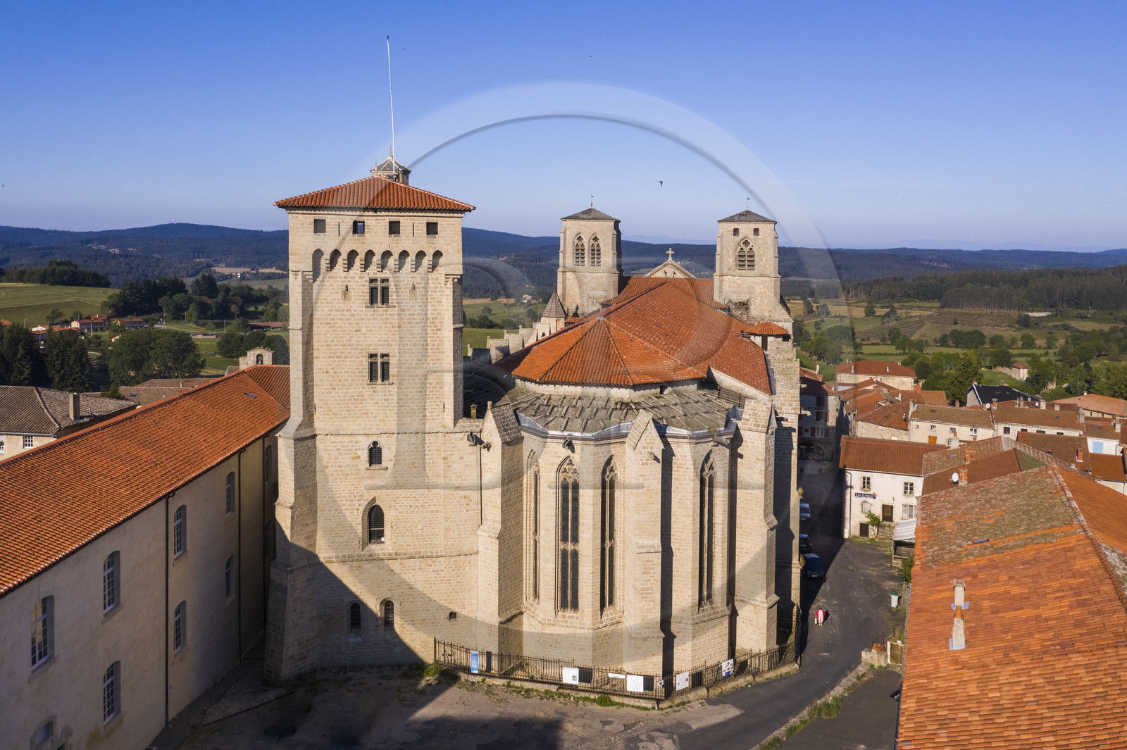 France, Haute Loire, Livradois Forez Regional Natural Park (Parc naturel régional Livradois-Forez), the Chaise-Dieu abbey, apse of the Saint-Robert abbey church and the Clementine tower (aerial view)