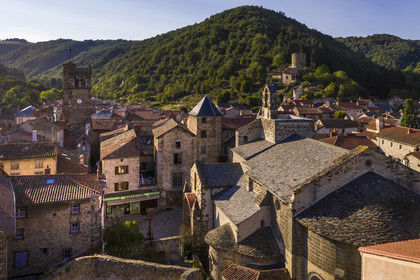 France, Haute Loire, Blesle, labelled Les Plus Beaux Villages de France (The most beautiful villages of France), Saint Pierre former abbey church in Auvergne Romanesque style, in the background, the Saint-Martin bell tower on the left and the Tour de Massadou on the right