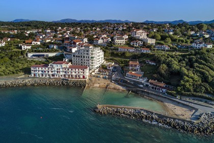 France, Pyrenees Atlantiques, Basque Country coast, Guethary, old whaling port overlooked by the former art deco Guétharia hotel built in the 1920s turned into a residence (aerial view)
