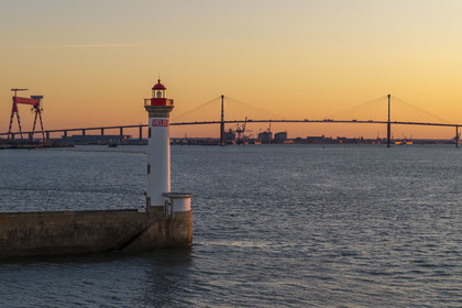 France, Loire-Atlantique, Saint-Nazaire, the Vieux Mole lighthouse and the Saint Nazaire bridge in the background (aerial view)