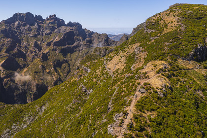 Portugal, Madeira Island, Vereda do Areeiro hike between Pico Ruivo (1862m) and Pico Arieiro (1817m), the path that climbs from Achada do Teixeira, the Pico Das Torres on the left  and the Pico Ruivo on the right (aerial view)