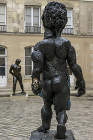 France, Paris, Musée Maillol art museum, sculpture Der Morgen oder Hölderlin, 2011, Painted bronze by the artist Markus Lüpertz, sculpture by Aristide Maillol, Chained Action, 1905, bronze in the background