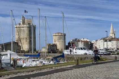 France, Charente-Maritime, La Rochelle, the Old Port, Tour Saint Nicolas and Tour de la Chaine protect the entrance to the Old Port, the tour de la Lanterne in the background
