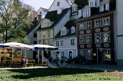 Latvia (Baltic States), Riga, old houses on Meistaru road and outside café