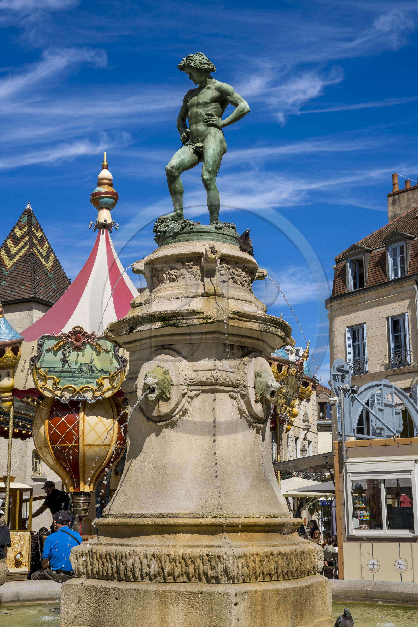 France, Cote d'Or, Dijon, area listed as World Heritage by UNESCO, Bareuzai fountain topped with the bronze sculpture The Harvester Treading the Grapes